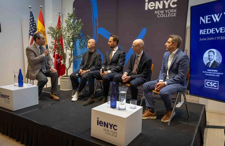 A panel discussion featuring several speakers at an event organized by iENYC in New York.